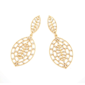 Close-up of golden hollow leaf earrings with sparkling rhinestone mesh detail