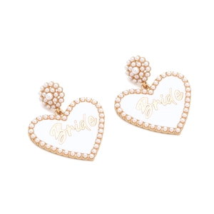 Detail of heart-shaped earrings featuring white pearls and gold Bride lettering for weddings