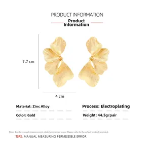 Detail view of gold textured leaf earrings with precise dimensions and zinc alloy specs