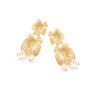 Macro shot of layered golden petal earrings with hammered texture and white pearls