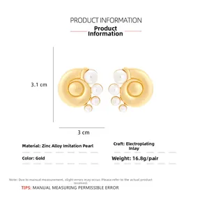 Detailed size chart for golden sea snail stud earrings with elegant white pearls