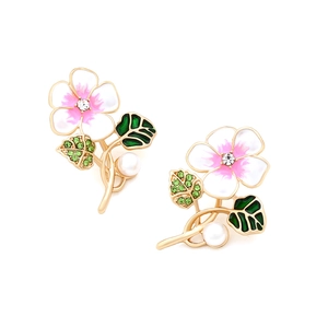 Detail of floral enamel earring with pink gradient petals, rhinestones, and white pearl