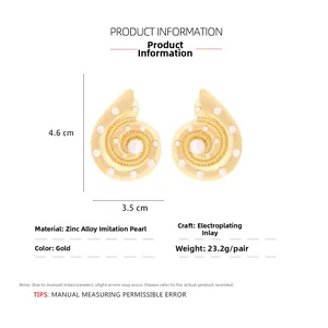 Detailed view of conch shell earrings in gold-tone metal with pearl inlays and dimensions