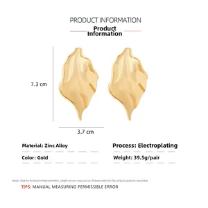 Detailed size chart of long gold leaf earrings showing 7.3 cm height and 3.7 cm width