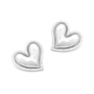 Detailed view of polished heart stud earrings in shiny silver with irregular 3D metallic surface