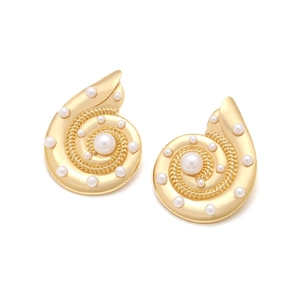 Exaggerated golden conch earrings with white faux pearls for a bohemian beach vacation style