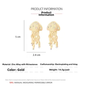 Macro detail of gold jellyfish earrings featuring crystal embellishments and sizing
