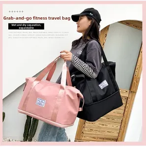 Detail of pink and black expandable travel bags featuring a dedicated wet-dry compartment