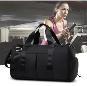 Detail of black waterproof gym bag with adjustable shoulder strap and side shoe compartment