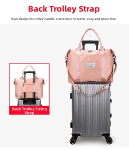 Pink nylon travel bag detail showing the back sleeve for luggage handle attachment