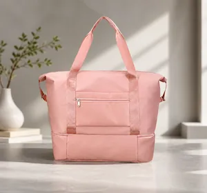 Back view of pink travel bag showing waterproof fabric and zipper bottom compartment