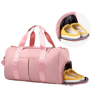 Pink travel bag detail showing independent shoe compartment for wet and dry separation