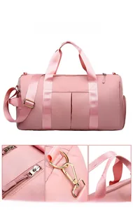 Pink travel bag detail featuring sturdy metal hooks, reinforced zippers, and comfortable handles