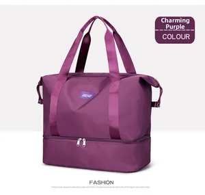 Macro shot of purple waterproof travel bag featuring a separate bottom wet-dry compartment