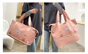 Detail showing the bottom expansion zipper layer on the pink waterproof travel bag
