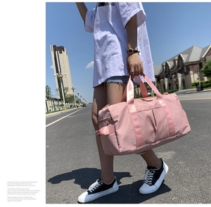 Pink large capacity waterproof travel bag with reinforced straps for fitness and gym use