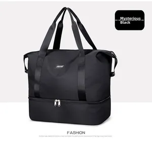 Detail of black waterproof travel bag featuring separate shoe compartment and reinforced handles