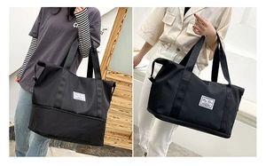 Versatile black expandable oxford gym bag shown on model for shoulder and hand carry