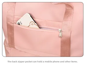 Pink travel bag back detail featuring a secure zipper pocket for phone storage