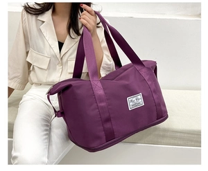 Detail view of large purple oxford cloth travel bag with dry wet separation feature
