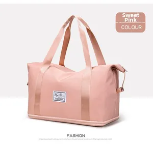 Detail of pink lightweight nylon gym bag with dry-wet separation and dual handles