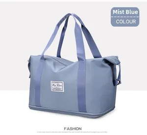 Detail of expandable wet-dry gym bag in mist blue Oxford fabric with brand label