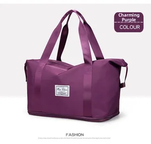 Detail view of the purple gym bag showing dry-wet separation and expandable bottom zipper
