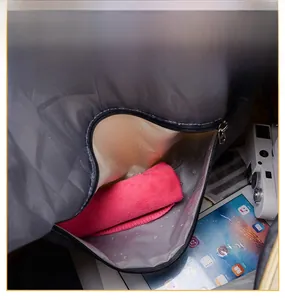 Detail of waterproof dry-wet separation pocket with transparent lining and red towel inside