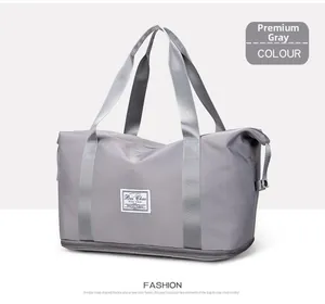 Detail view of grey oxford travel bag featuring bottom wet dry separation compartment