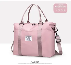 Detail of sakura pink nylon travel bag with waterproof texture and durable handle