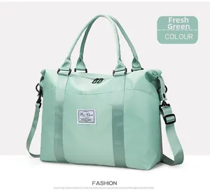 Detail of fresh green waterproof nylon fabric and reinforced handle on the travel bag