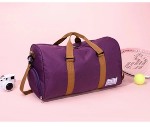 Detail shot of purple travel duffel bag showing smooth nylon texture and side zipper pocket