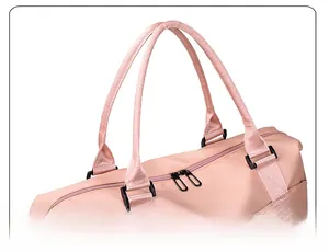 Close-up of thickened comfortable handles on a pink nylon water-resistant travel bag