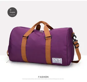 Close-up of purple travel duffel bag showing durable straps and Bai Chao brand label