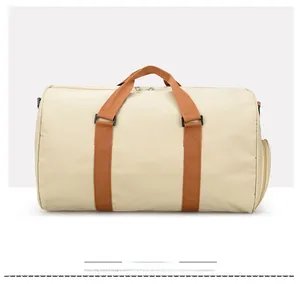 Detail view of the travel duffel bag side featuring a dedicated zipper storage compartment