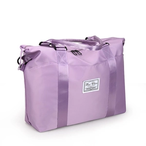 Large purple waterproof nylon travel bag with handles and adjustable shoulder strap