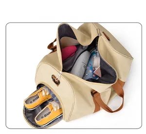 Detail view of large canvas travel bag showing the spacious interior and separate shoe compartment