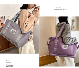 Detail of waterproof nylon travel totes in grey-purple and dark purple with logo label