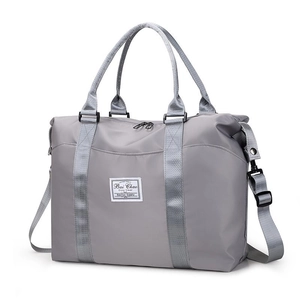 Large capacity gray waterproof nylon travel bag with durable handles and shoulder strap