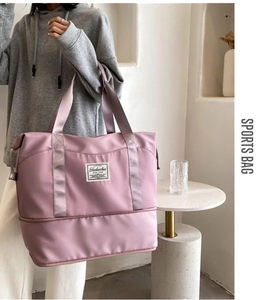 Detail view of pink waterproof sports bag with separate bottom shoe compartment