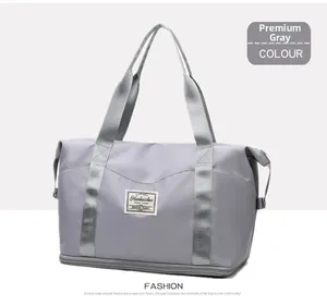 Detail of high-capacity gray fitness bag featuring waterproof nylon and durable straps