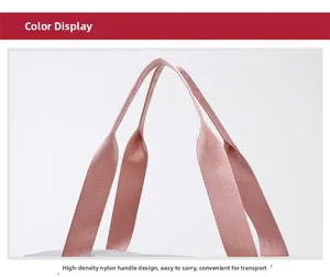 Detailed macro view of the durable pink nylon handles and refined stitching on the gym bag