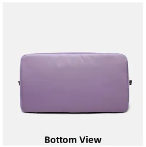 Detailed bottom view of purple nylon sports bag showing flat base and durable stitching
