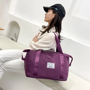 Deep purple expandable travel bag for gym and luggage storage with waterproof fabric