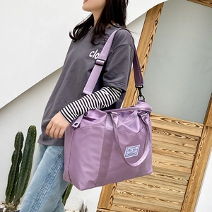 Large purple nylon travel bag with wet-dry separation and adjustable shoulder strap