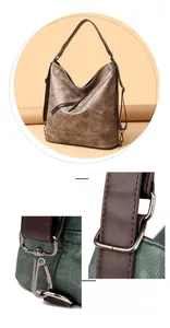 Détail du sac hobo vintage montrant la texture du cuir froissé et la ferronnerie sombre