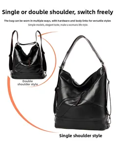 Détails du sac en cuir noir montrant la bandoulière réglable pour port à l'épaule ou au dos