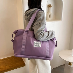 Large purple waterproof nylon sports bag with separate shoe compartment for gym and travel