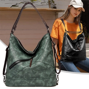 Détail du sac cabas en cuir souple avec fermeture éclair diagonale et vue portée par mannequin