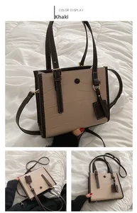 Detailed views of khaki crocodile embossed tote bag with adjustable strap and metallic snap